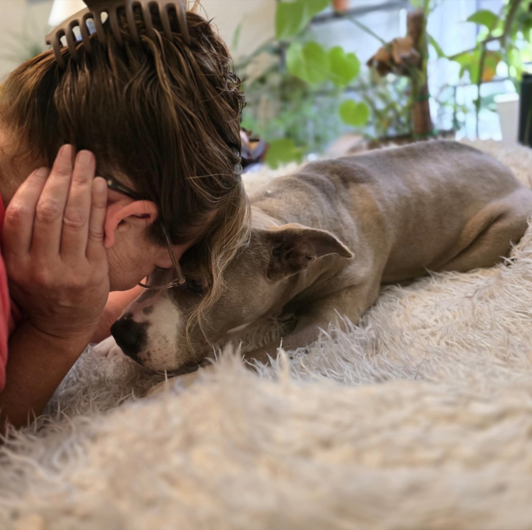 Stephanie resting her forehead against Soco’s head