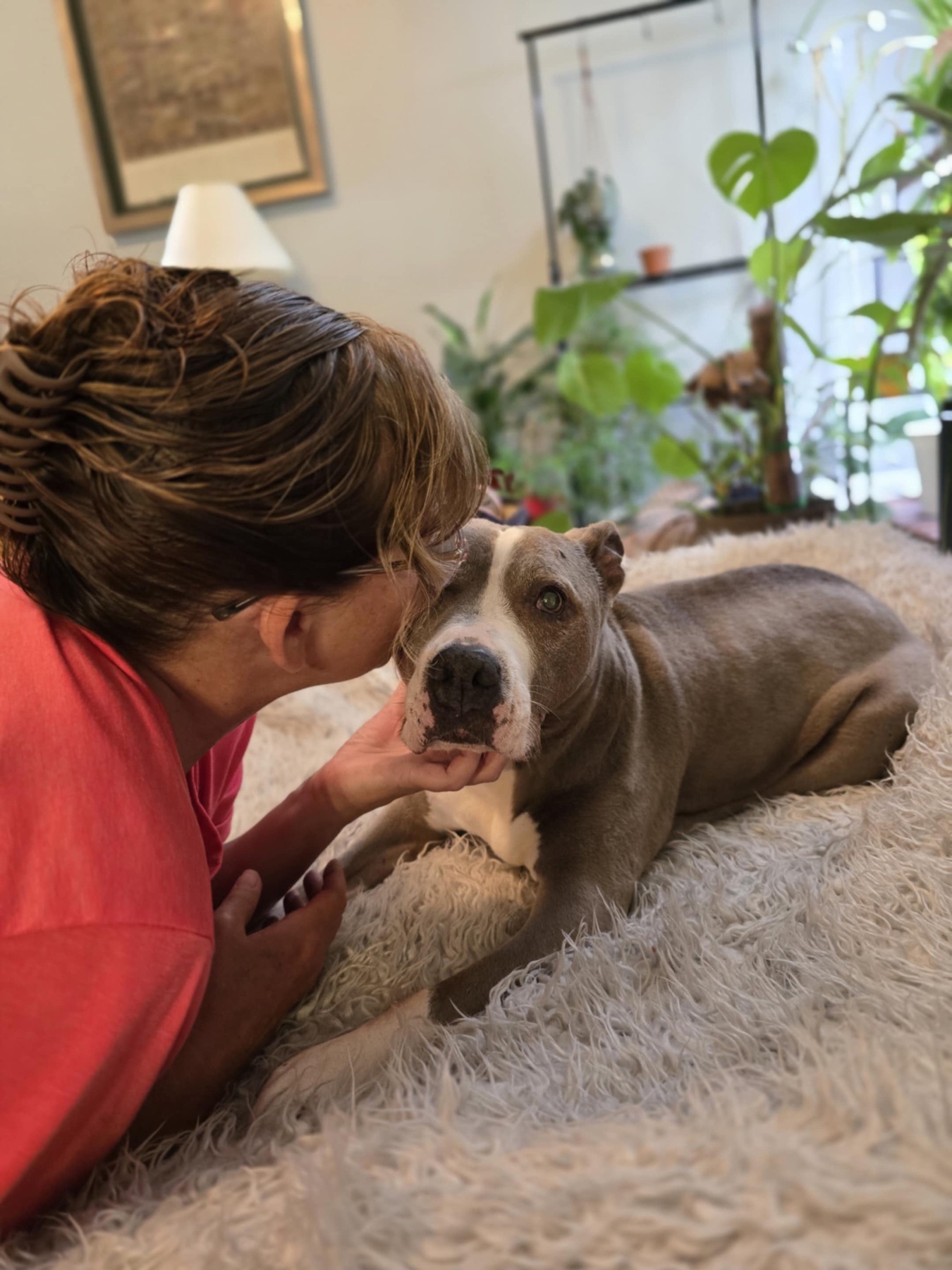 Stephanie holding Soco close at home